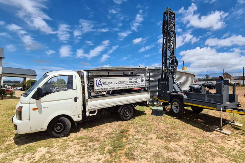 Borehole drilling rig on site
