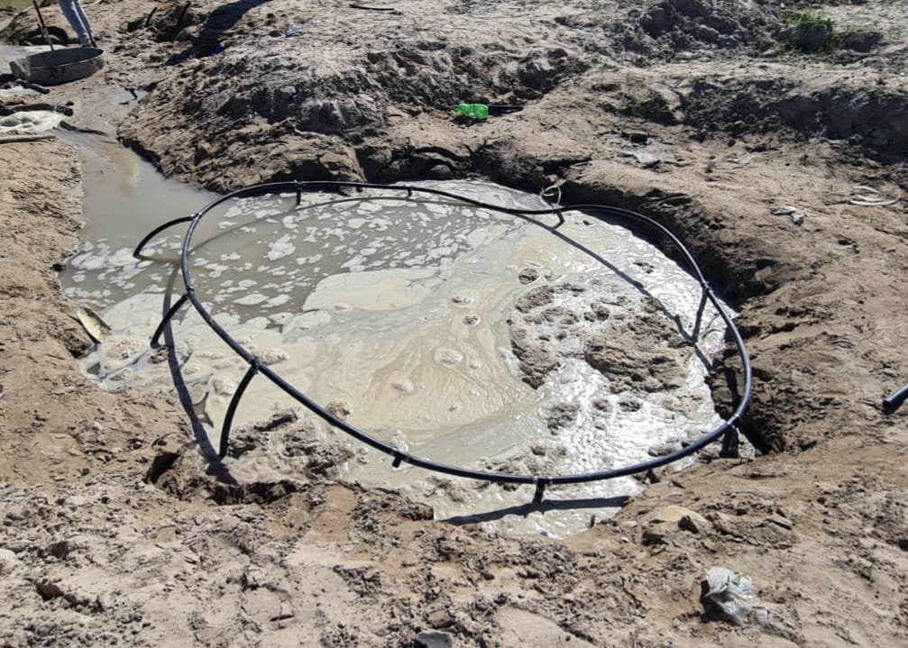 Dewatering pit drawing down groundwater on site